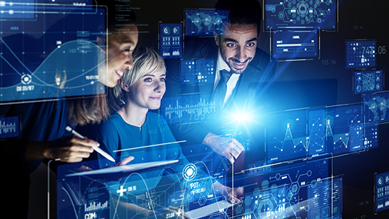 Ai Intelligence employees viewing graphs on screens.
