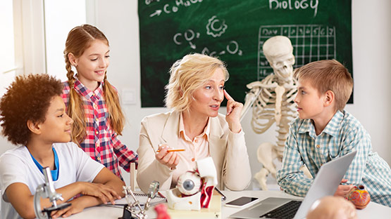 Biology Teacher with students
